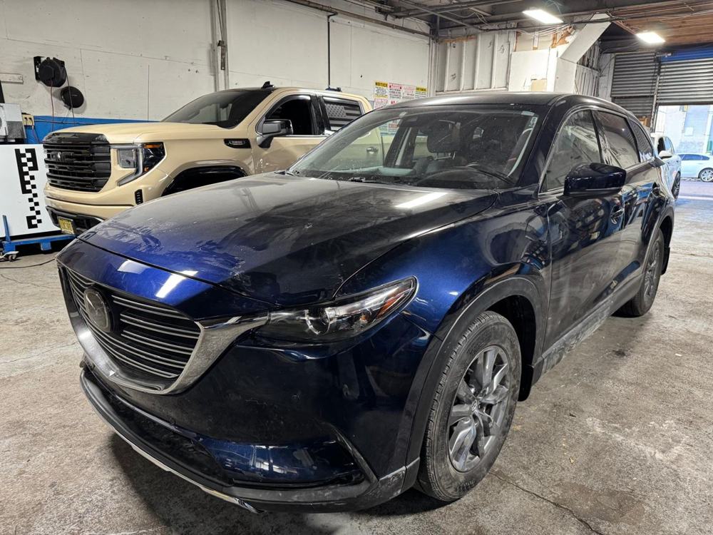 Mazda CX-9 in front of ADAS calibration targets