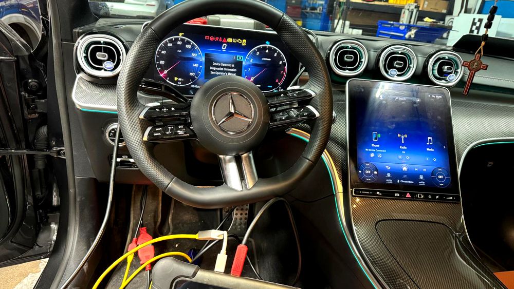 Diagnostic scanner connected to a Mercedes-Benz C-Class