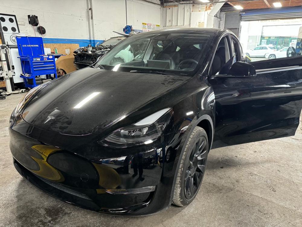 Tesla Model Y in front of ADAS calibration targets